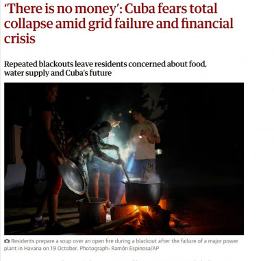 cuba ollas en la calle con leña para cocinar.jpg